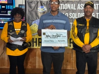Joshua Strickland scholarship check presentation