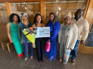 Kyndall Collins with family at 2026 scholarship award ceremony